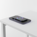 Sleek wireless charging pad with smartphone charging on a desk