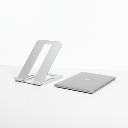 Adjustable aluminum laptop stand on a clean desk